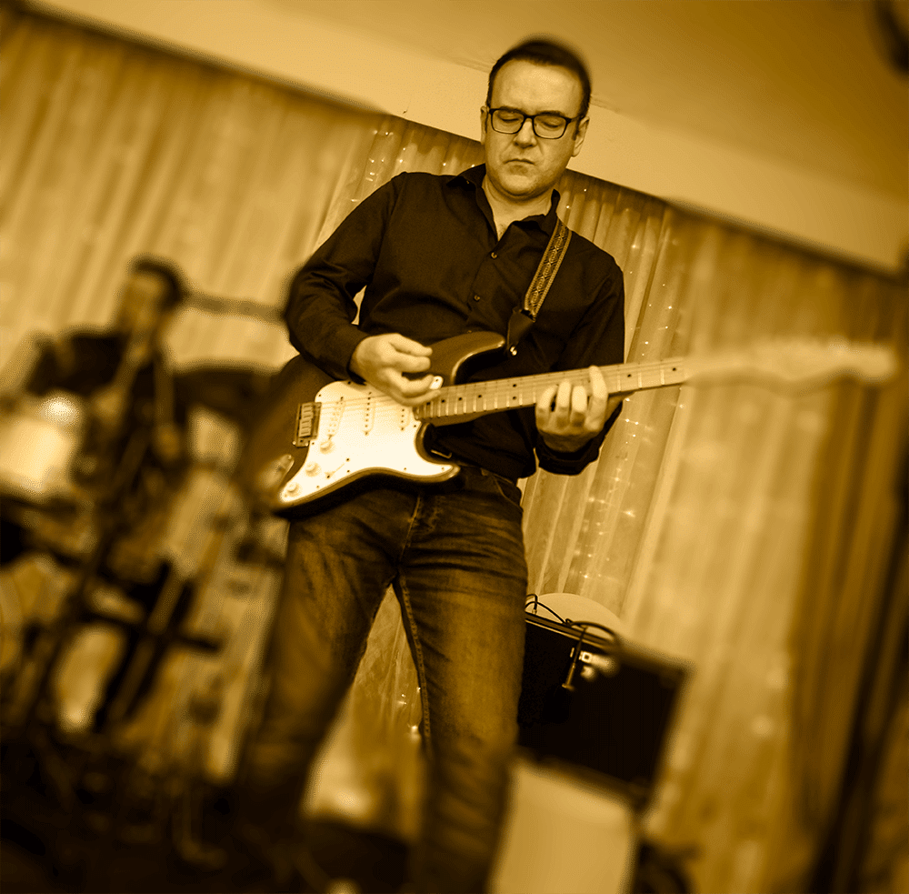 Gavin Murphy plays guitar with The Moogs