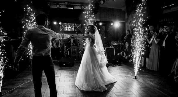 A couple do their First Dance with fireworks